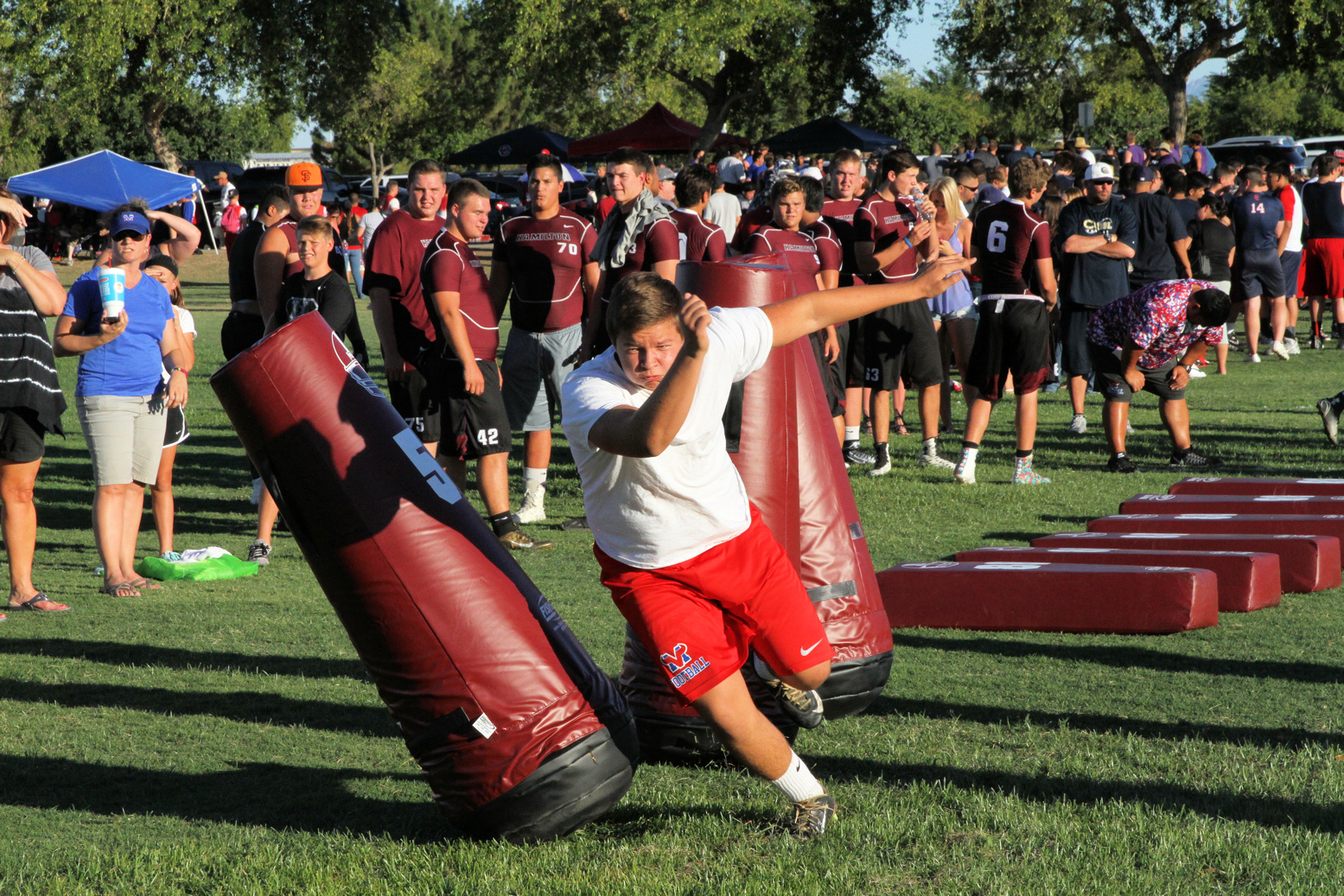 Football player runs through obstacles